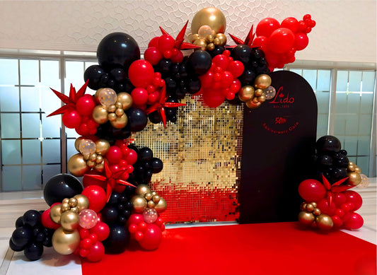 Luxury red, black, and gold balloon decor with custom backdrop for Lido’s 50th anniversary corporate gala. Bold, dramatic, and perfect for milestone celebrations and upscale events.