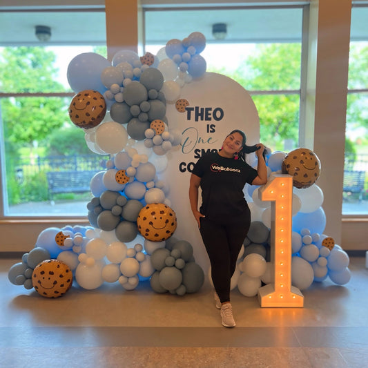 is One Smart Cookie-themed balloon garland with pastel tones and custom backdrop — perfect for first birthdays or kids’ parties in Toronto, Vaughn, King City Bradford