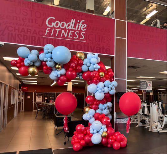 Balloon garland in red, blue, and gold for GoodLife Fitness corporate event entrance
