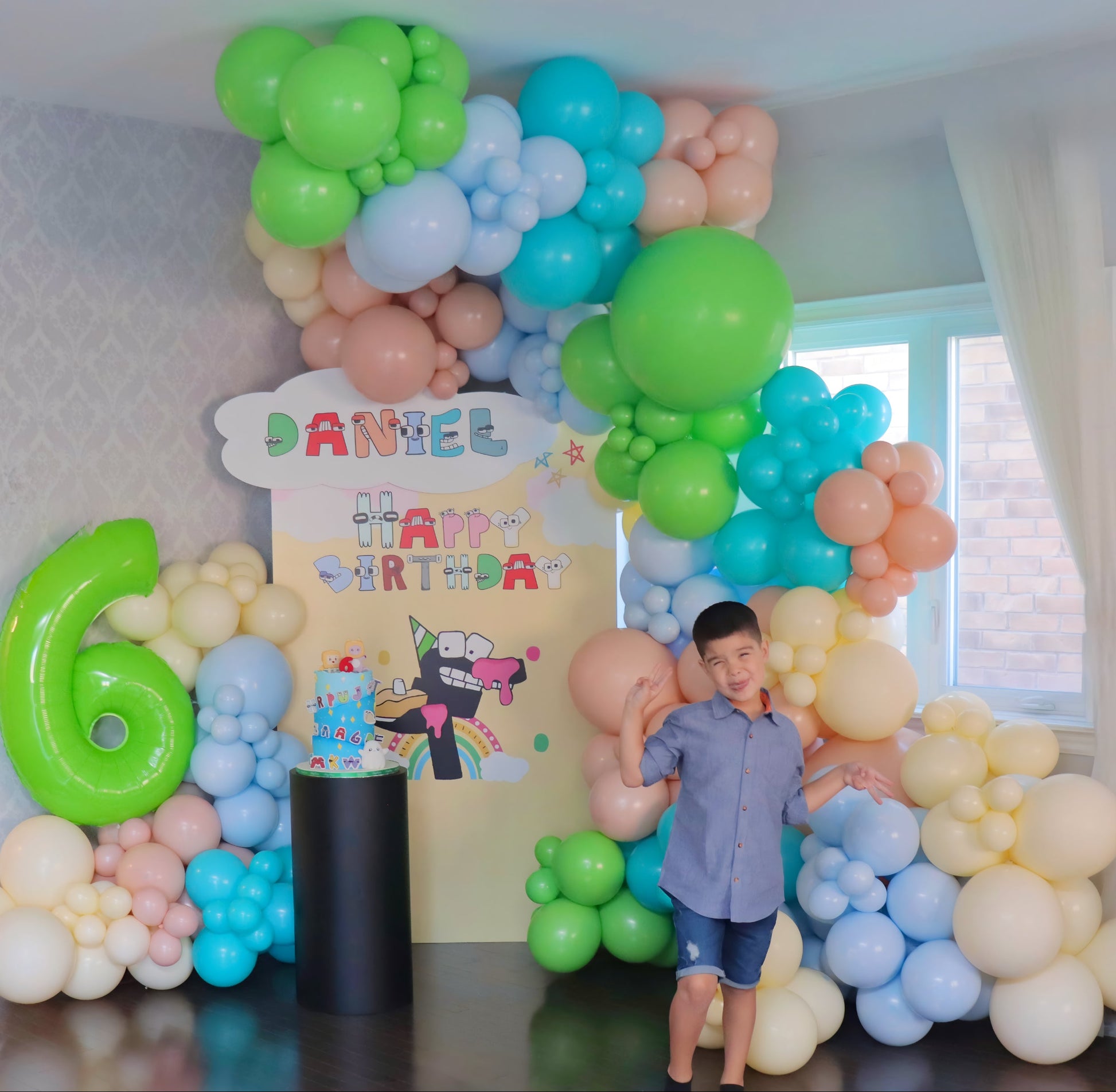 Alphabet Lore themed balloon backdrop with pastel balloons and a green number 6, created for a child’s birthday celebration in Toronto.