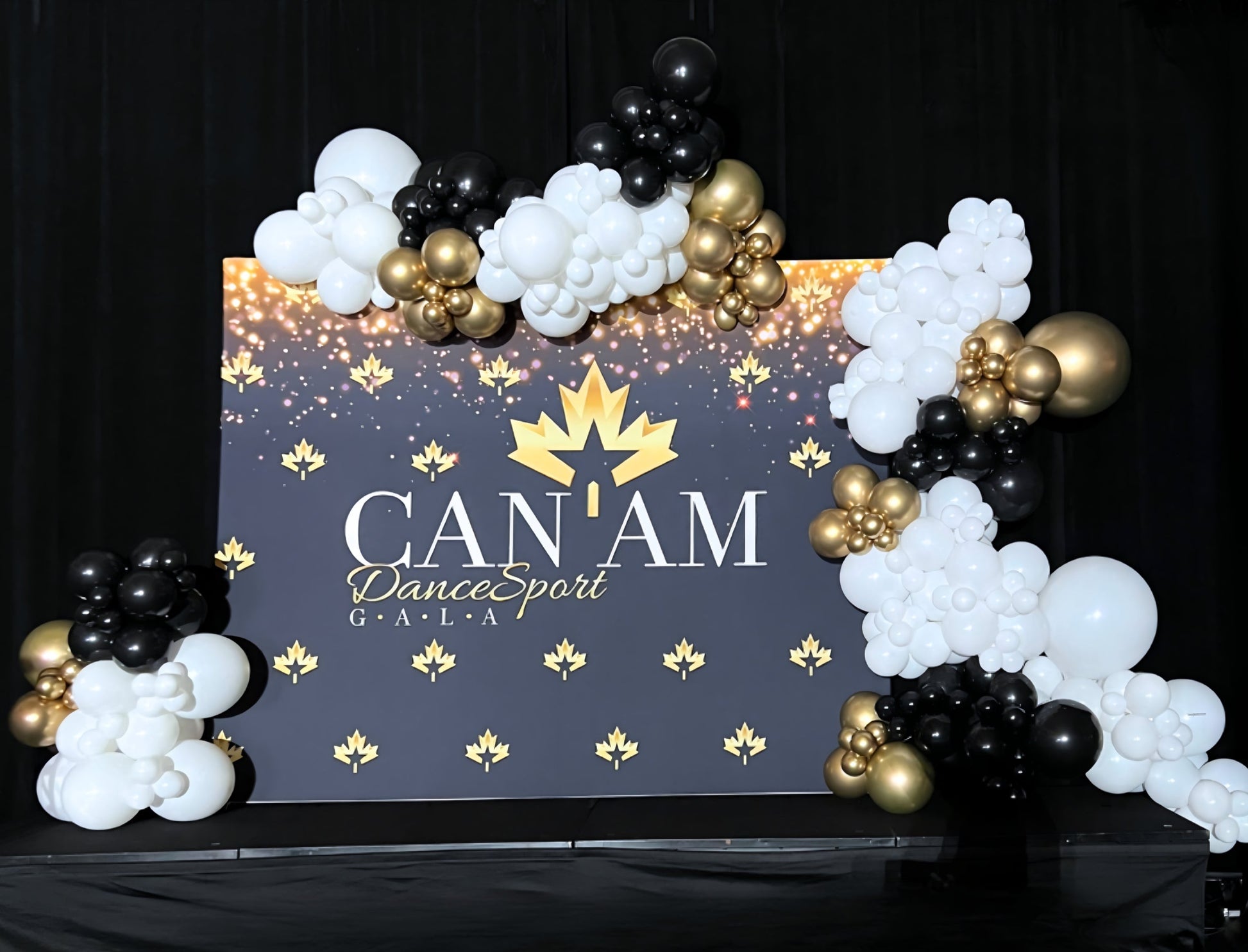 Elegant black, white, and gold balloon backdrop for CAN-AM DanceSport Gala corporate event