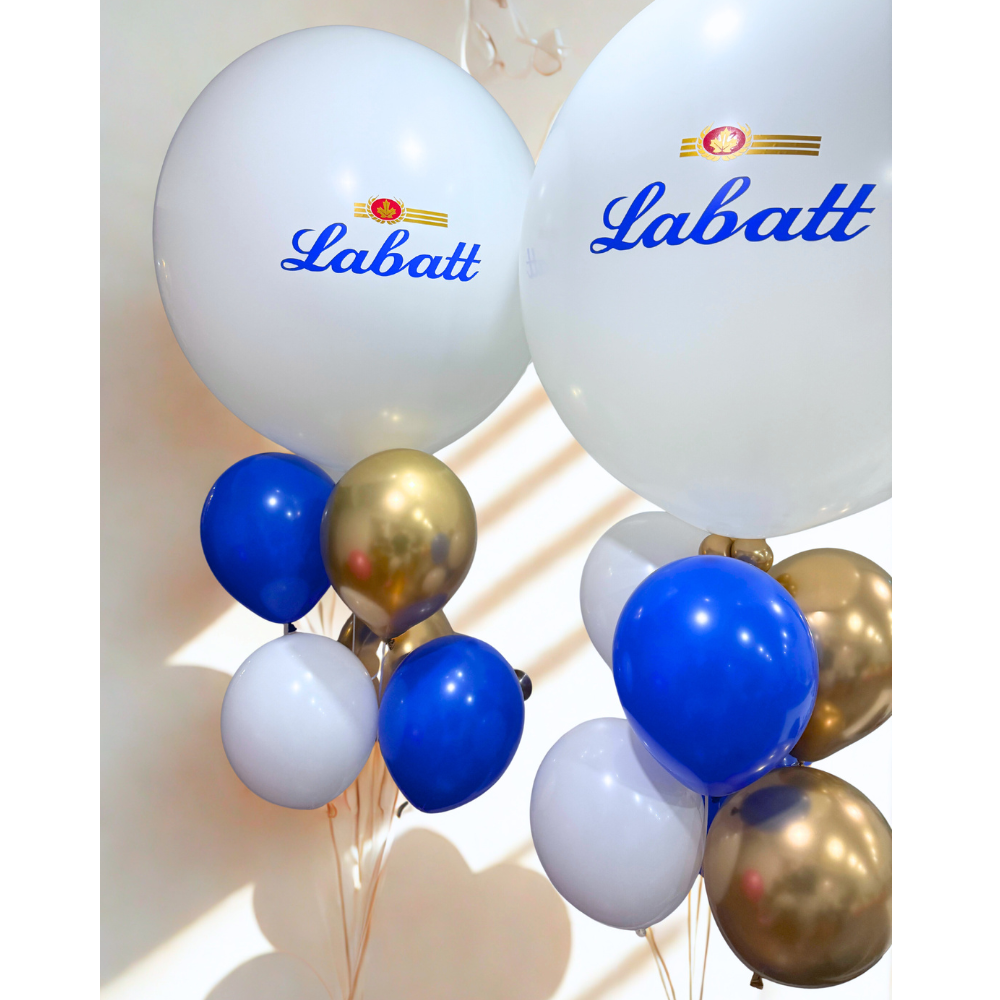 Corporate helium balloon bouquet in blue, gold, and white with giant branded Labatt balloons, perfect for company events and brand activations.