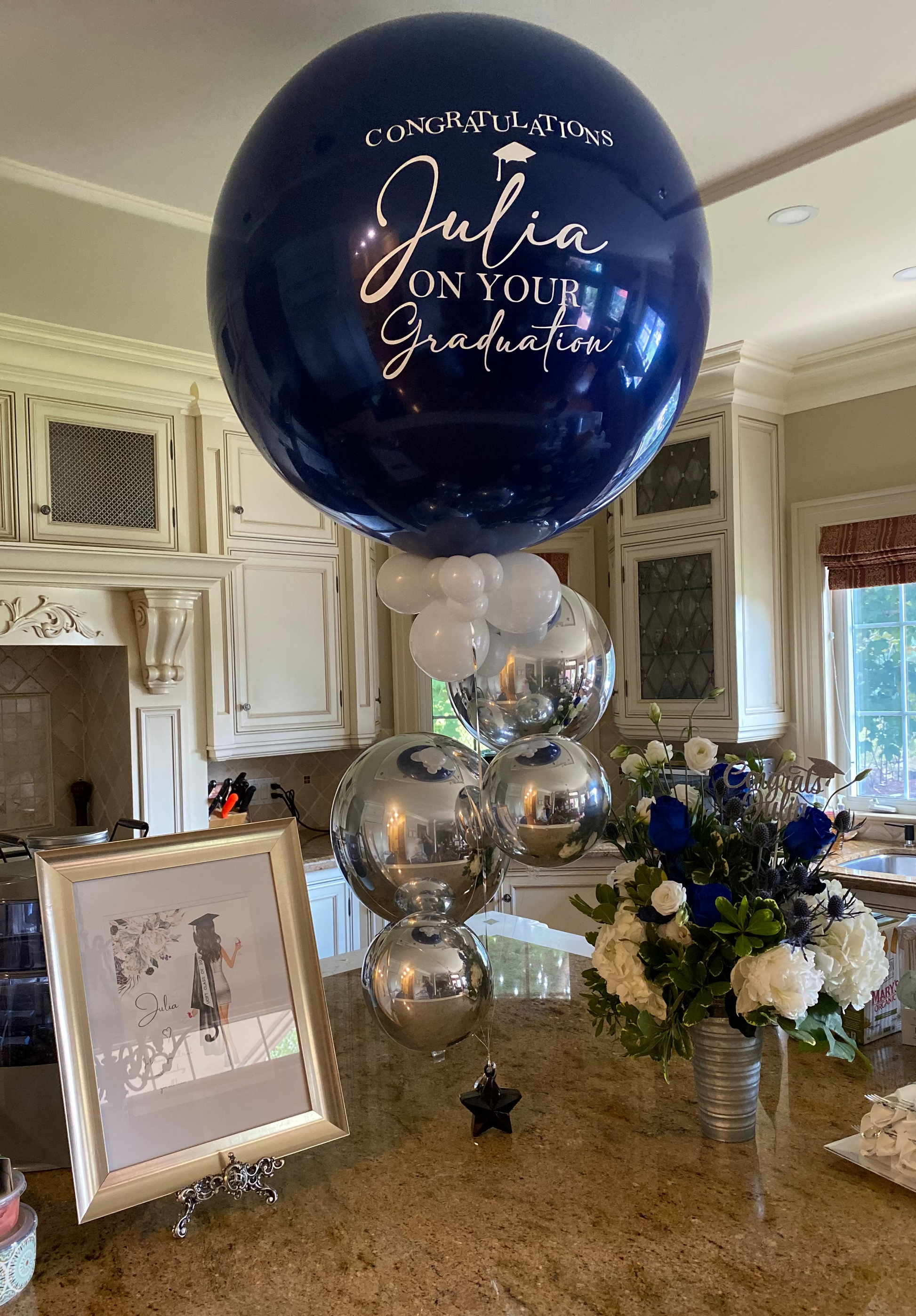 Luxury jumbo navy and silver metallic graduation helium bouquet with custom 'Congratulations Julia' message by WeBalloonz.