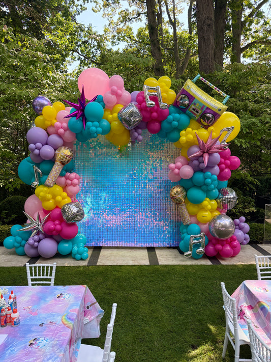Premium organic colorful balloon arch with iridescent shimmer wall backdrop and disco-themed specialty foils for a luxury Taylor Swift or 80s dance party in King City by WeBalloonz