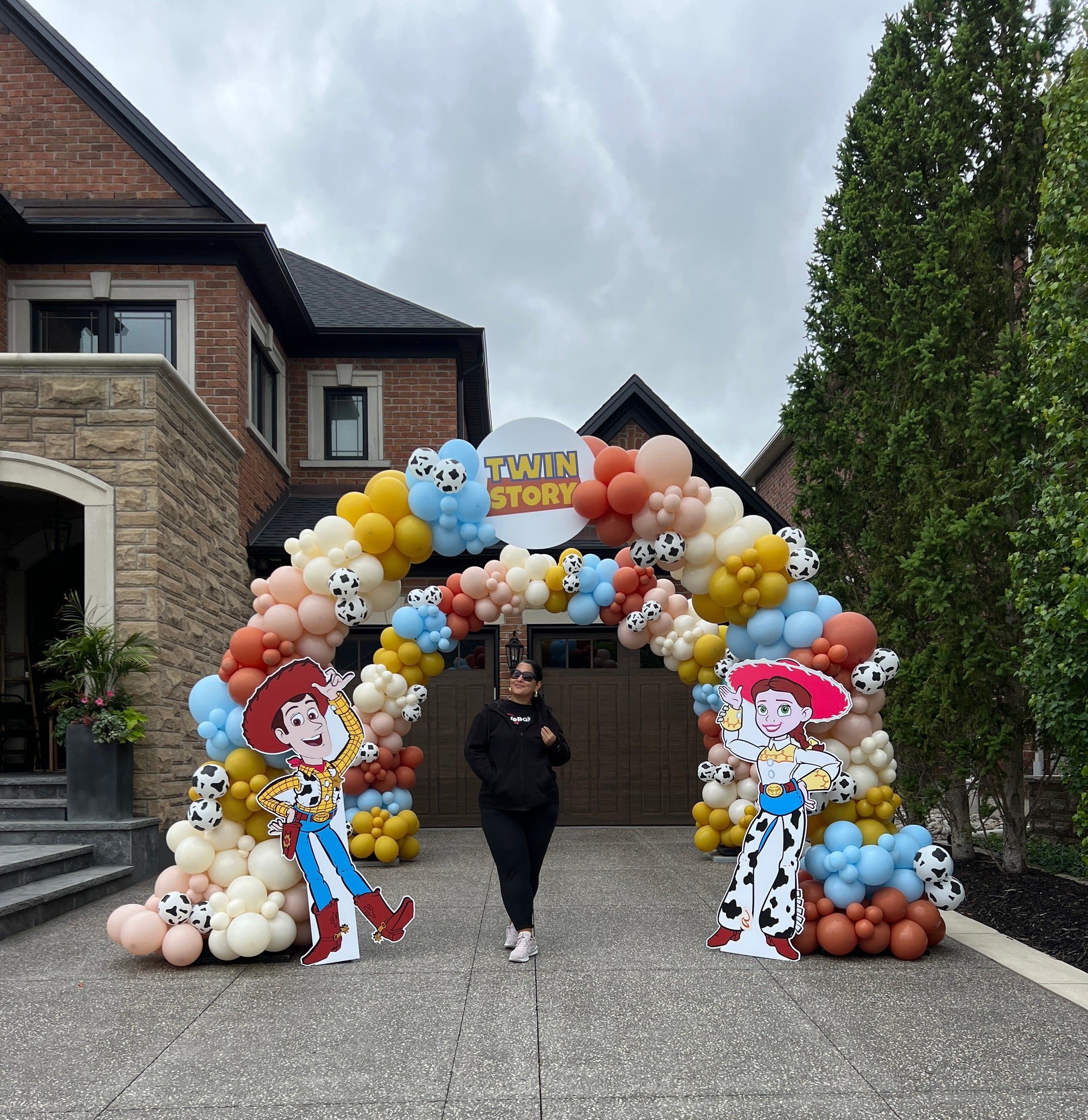 Grand double organic balloon arch installation for a luxury 'Twin Story' themed event in King City by WeBalloonz, featuring two layered arches