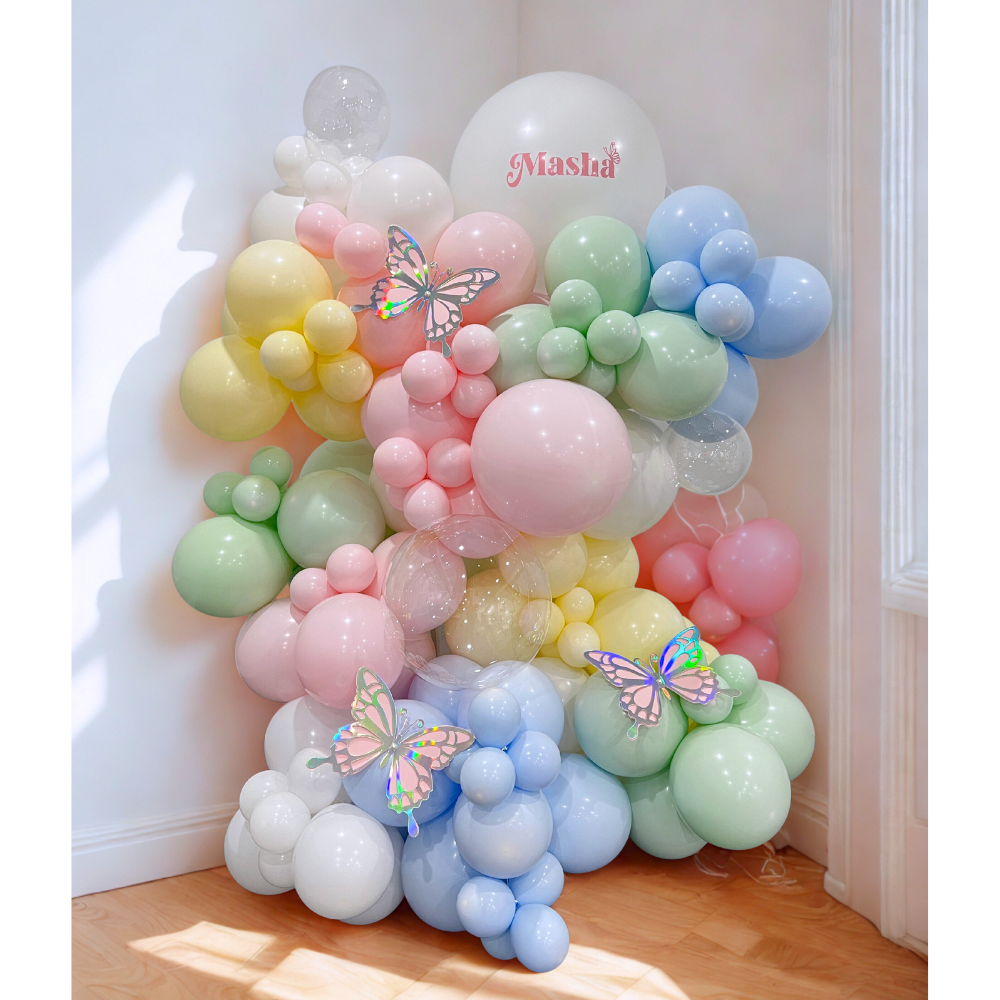 Stand alone pastel balloon garland with butterflies in pink, blue, yellow, green, and white for parties or baby showers