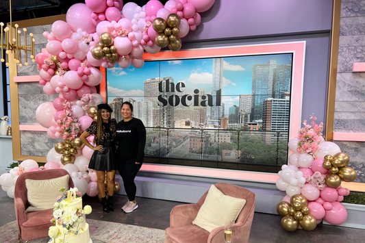 Luxury pink and gold organic balloon installation for 'The Social' television set in Toronto, featuring professional event branding decor.